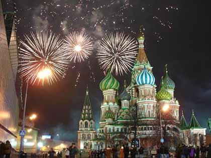 A photo of St. Basil in Moscow with fireworks brimming in the background