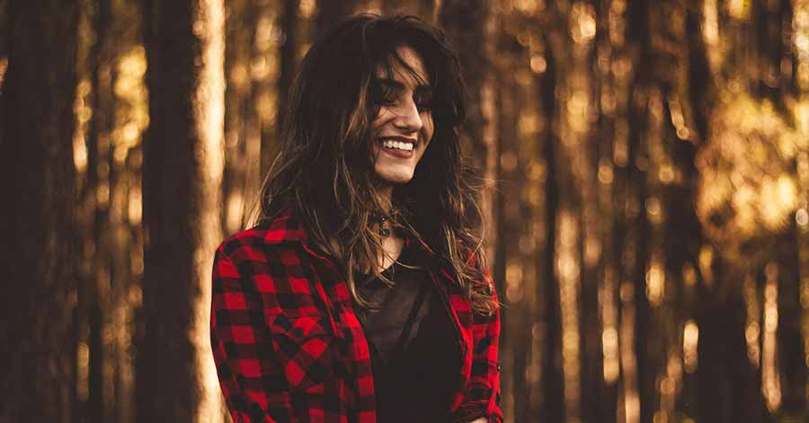 lady smiling in the forest