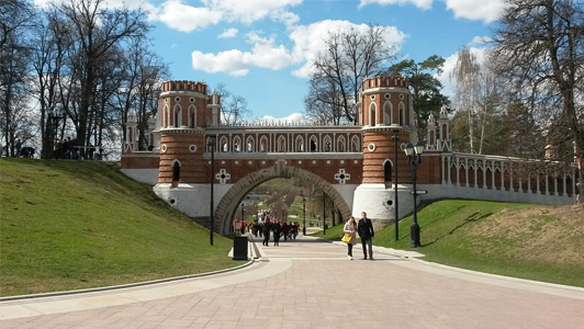 Couple walking on the street in Tsaritsyno, Moscow, Russia